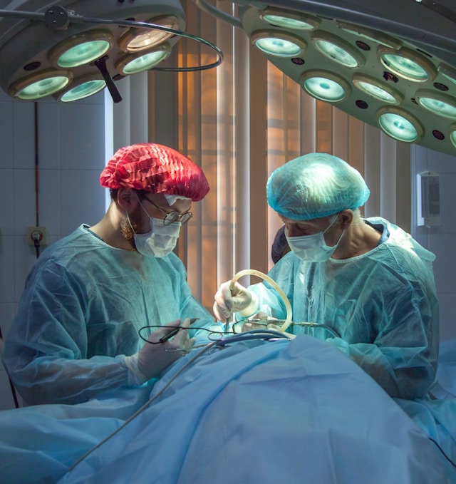 Medical team performing surgery — surgeons in an operating room demonstrating medical teamwork
