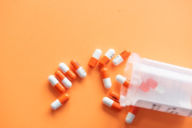 Pharmaceutical capsules and prescription bottle — representing evidence-based prescribing practice